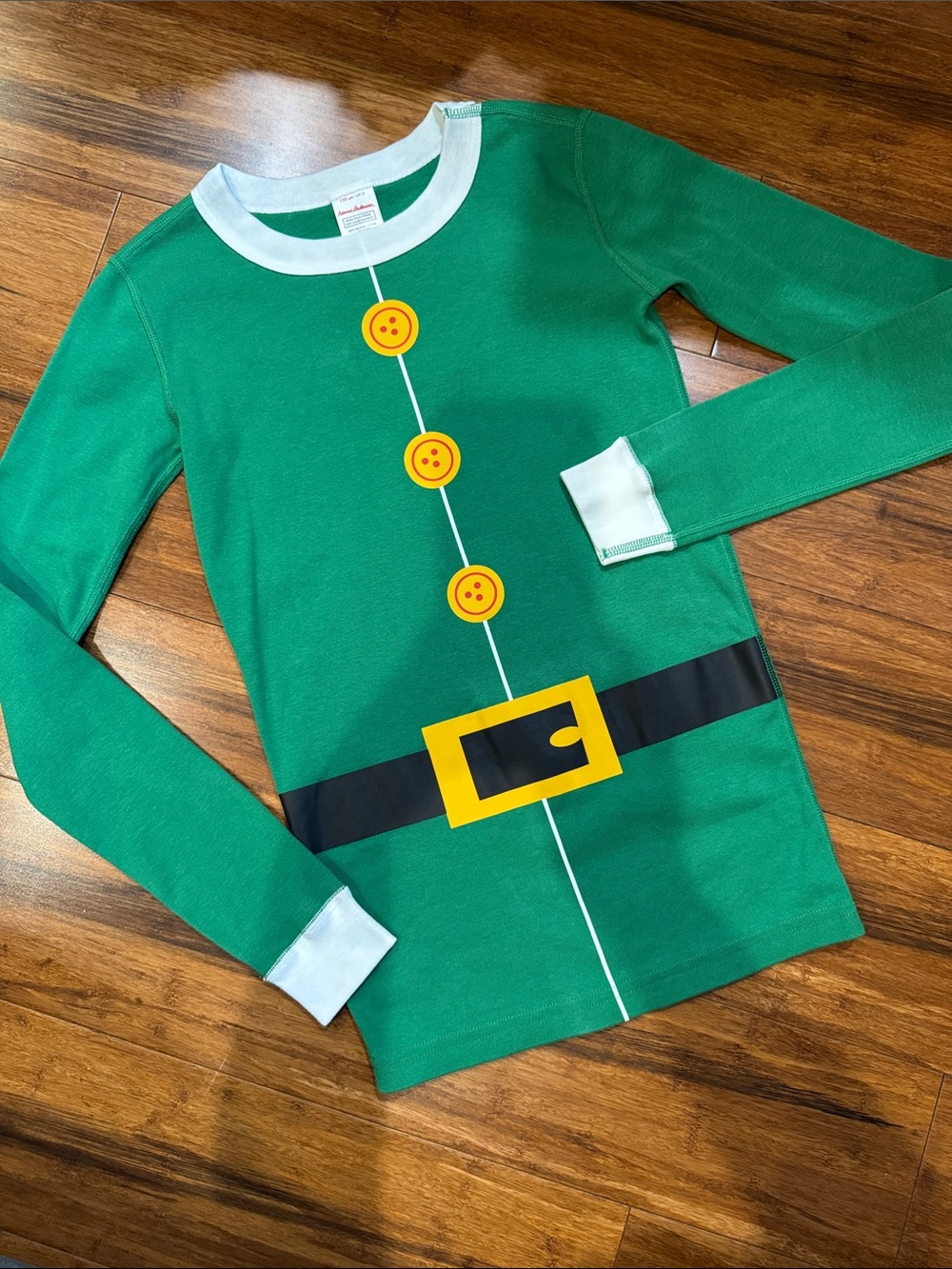 Hanna Andersson Green Elf Top with Yellow Button and Black Belt Print